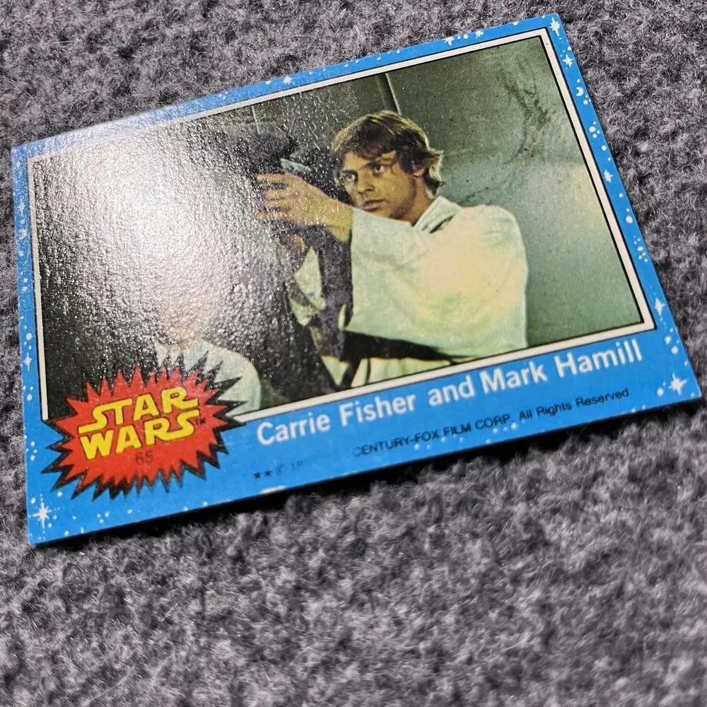Carrie Fisher and Mark Hamill 1977 Topps Star Wars Card TCG #65